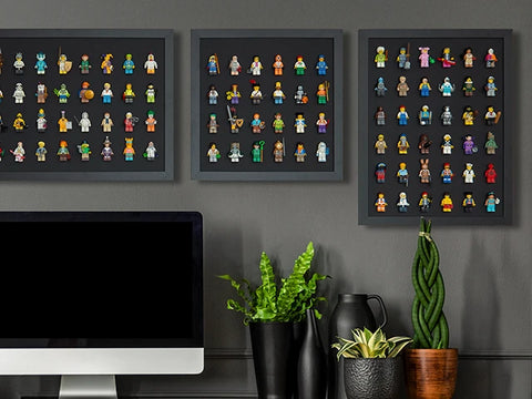 Black LEGO minifigure display frames in a home office