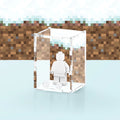 Acrylic display case with custom printed pixelated snow design that fits one minifigure