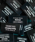 Pile of black LEGO Batman identification tiles