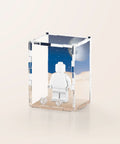 Classic space graphic printed onto the back of a clear acrylic display case for a single LEGO minifigure