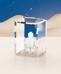 Classic space graphic printed onto the back of a clear acrylic display case for a single LEGO minifigure