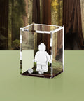 Acrylic display case with custom printed forest design that fits one minifigure