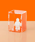 Orange colored acrylic display case for a single LEGO minifigure