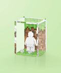 Pixel grass graphic printed onto the back of a clear acrylic display case for a single LEGO minifigure