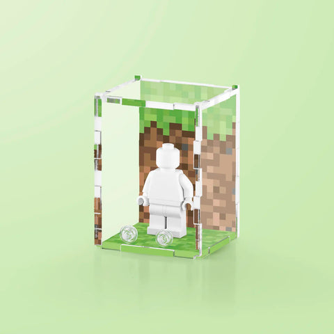 Pixel grass graphic printed onto the back of a clear acrylic display case for a single LEGO minifigure