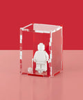 Red acrylic display case for a single LEGO minifigure