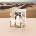 Acrylic display case with sand dune graphic background that fits one LEGO minifigure